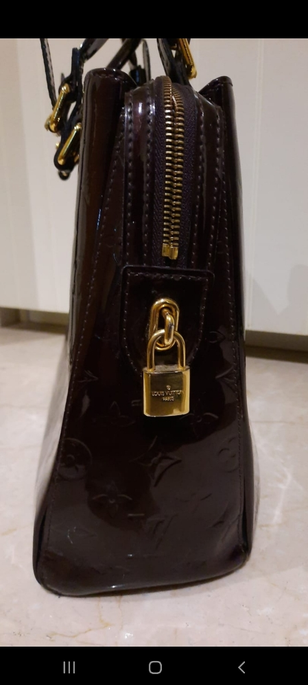 Sold at Auction: Louis Vuitton Amarante Vernis Leather Sobe Clutch